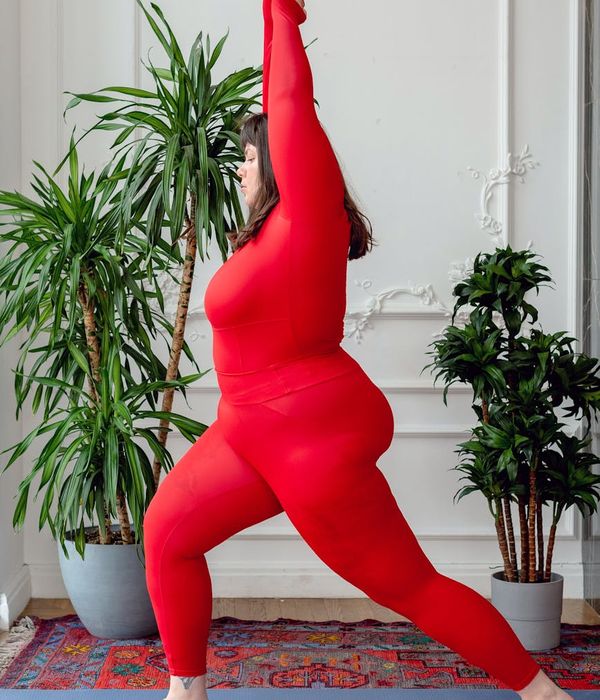 Athlete in a powerful yoga warrior pose, demonstrating strength and balance.